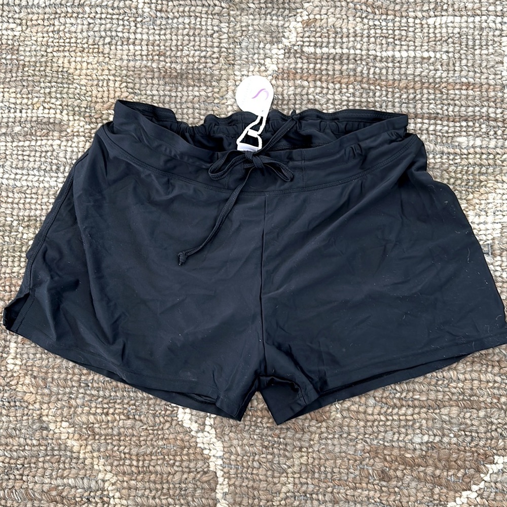 New black swim shorts with pocket. Size XXL.
